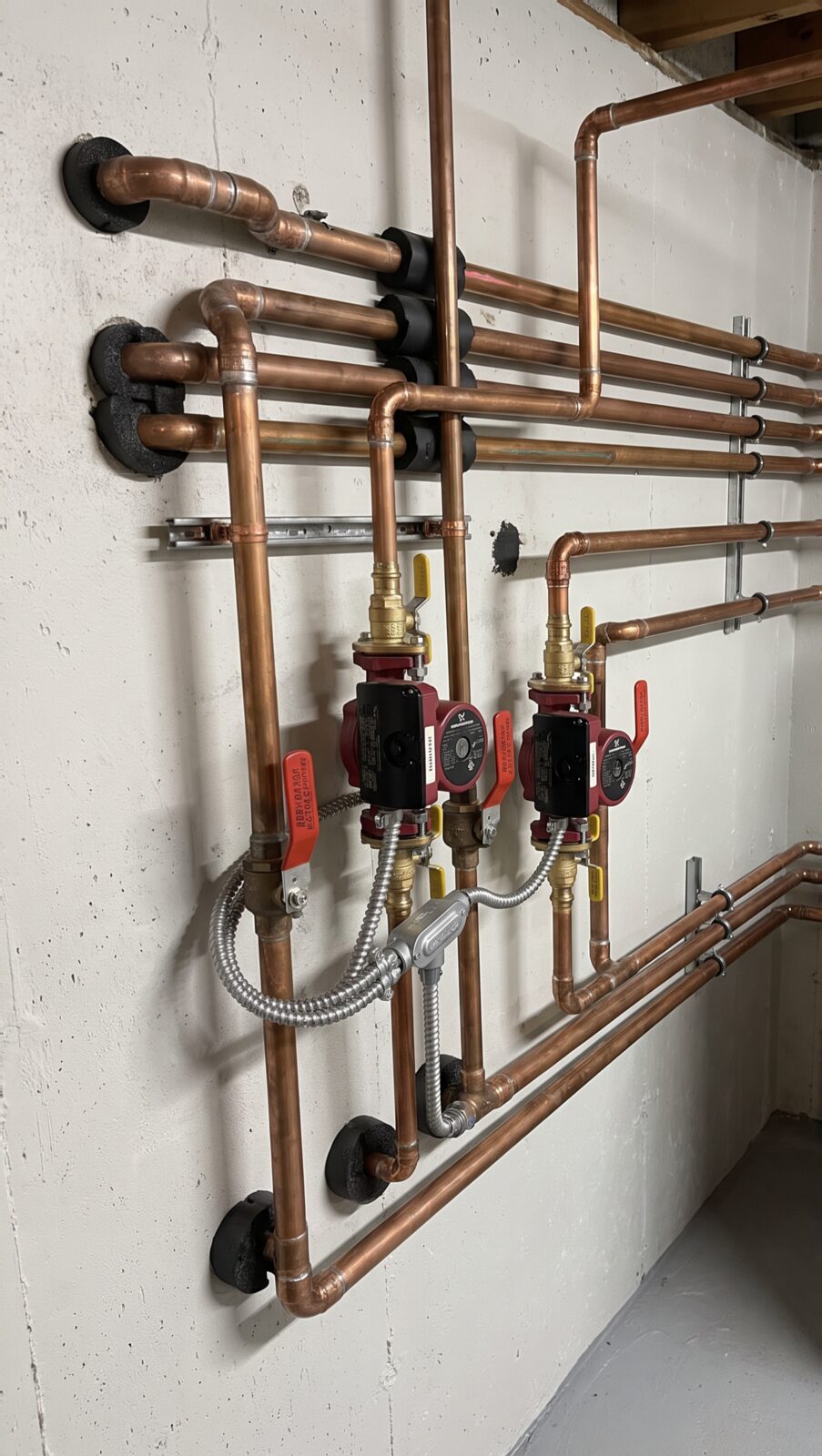 Copper manifold with circulator pumps and isolation valves